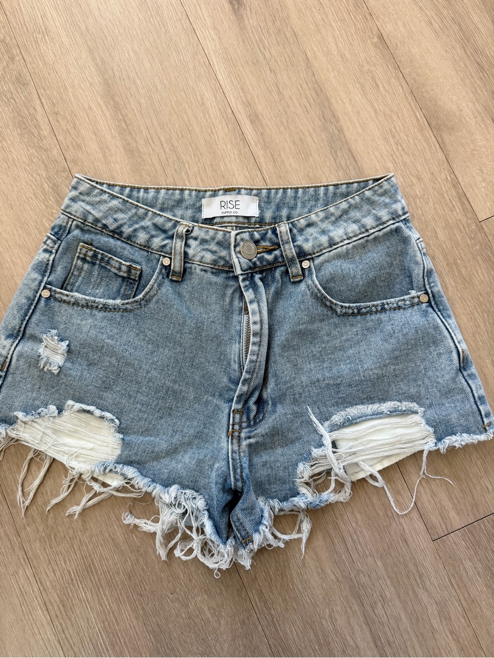 Distressed Light Wash Denim Cutoff Shorts